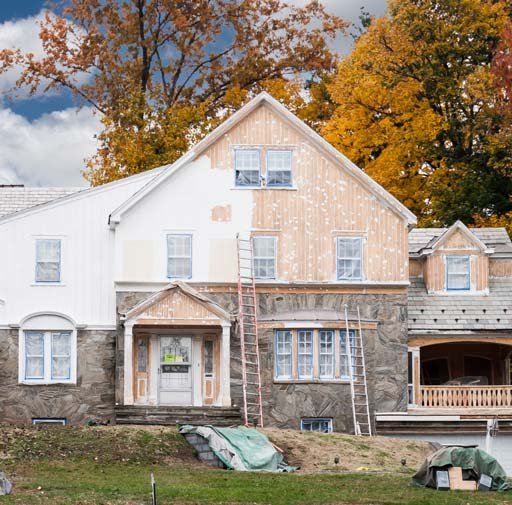 A beautiful home being given a full exterior paint makeover by The Honey Do Service, Inc. 