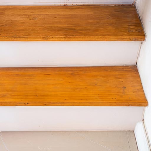 Wood stairs replaced and stained to match with surrounding stairs by Honey Do Service craftsmen