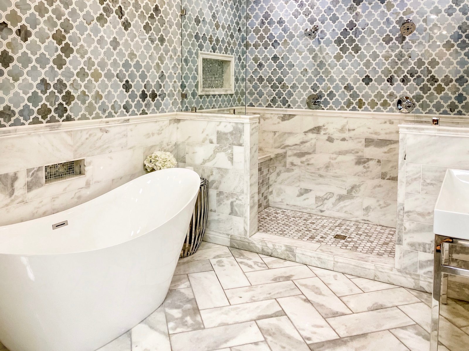 tile bathroom flooring with grout and modern freestanding tub