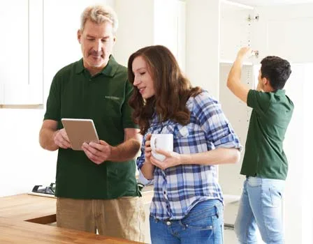 An employee of The Honey Do Service, Inc. discussing Renovations with a Client Partner An employee of The Honey Do Service, Inc. discussing Renovations with a Client Partner