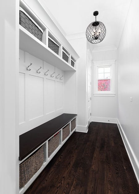 Entryway with In-wall shelving, storage, and bench