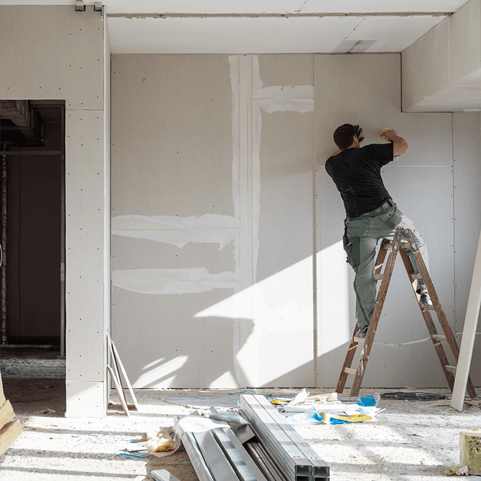 Honey Do Worker Remodeling House by Replacing Drywall
